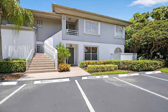 20220 Boca W Dr Unit 1104, Boca Raton, FL 33434 - sunroom featuring ceiling fan and golf course view