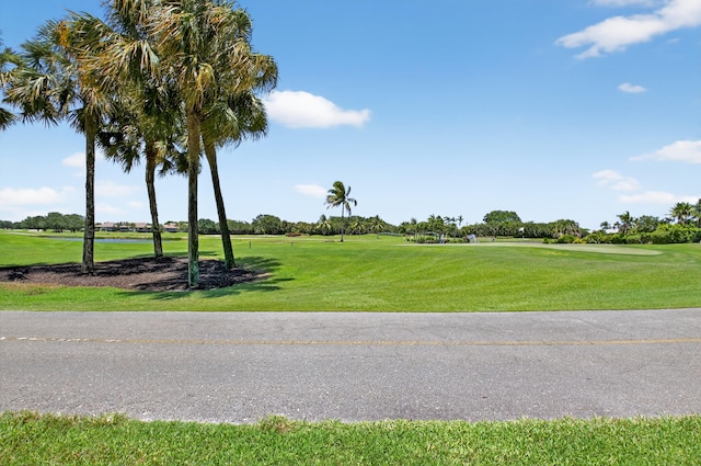 20220 Boca W Dr Unit 1104, Boca Raton, FL 33434 - rear view of property with a yard and a sunroom