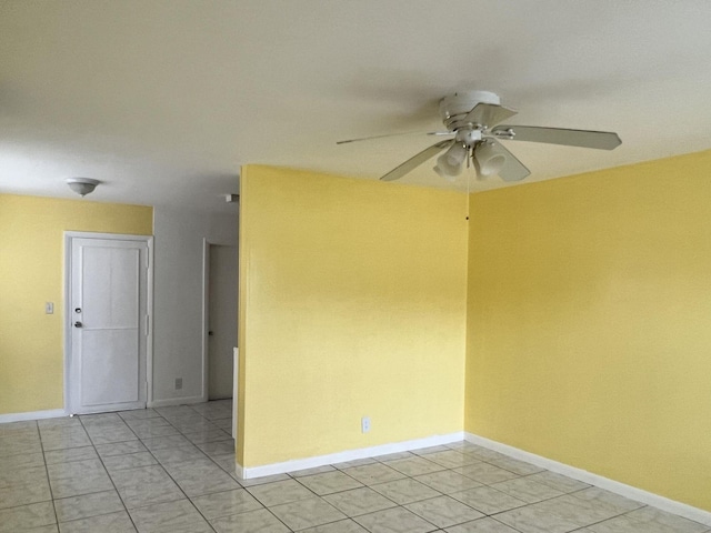 5042 Eadie Pl, West Palm Beach, FL 33407 - unfurnished room with a ceiling fan, baseboards, and light tile patterned flooring