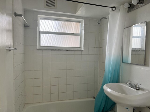 5042 Eadie Pl, West Palm Beach, FL 33407 - full bathroom featuring shower / tub combo with curtain and a sink