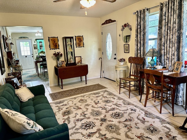 3595 SW 19th St, Okeechobee, FL 34974 - living area featuring light tile patterned flooring, a ceiling fan, and a textured ceiling