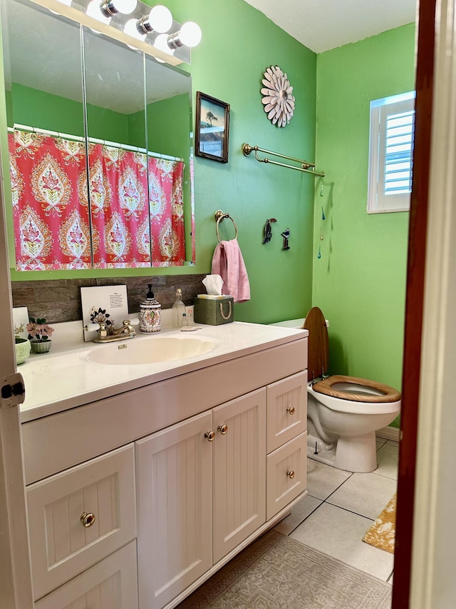 3595 SW 19th St, Okeechobee, FL 34974 - bathroom featuring toilet, vanity, tile patterned flooring, and a shower with shower curtain