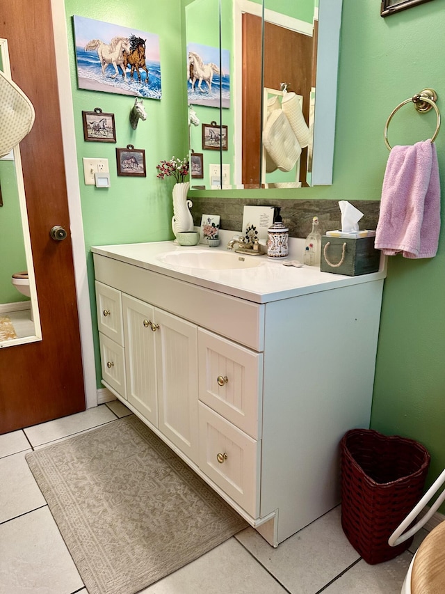 3595 SW 19th St, Okeechobee, FL 34974 - bathroom featuring vanity, toilet, and tile patterned flooring