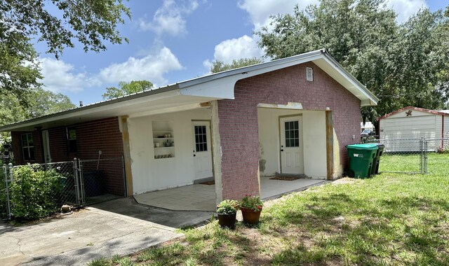 3595 SW 19th St, Okeechobee, FL 34974 - view of front of property with a gate and brick siding