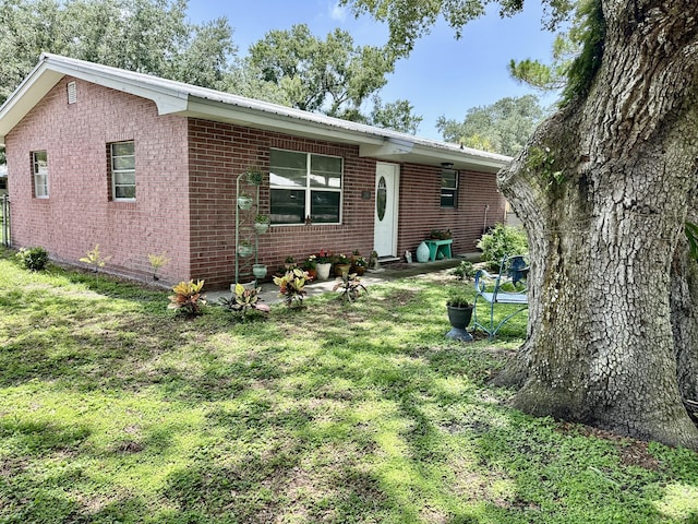 3595 SW 19th St, Okeechobee, FL 34974 - single story home featuring a front lawn and brick siding