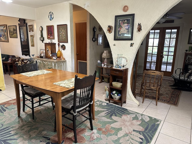3595 SW 19th St, Okeechobee, FL 34974 - tiled dining area with arched walkways, a ceiling fan, and a textured wall