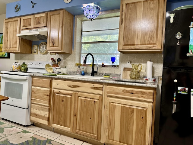 3595 SW 19th St, Okeechobee, FL 34974 - kitchen featuring freestanding refrigerator, under cabinet range hood, white electric range, a sink, and tasteful backsplash