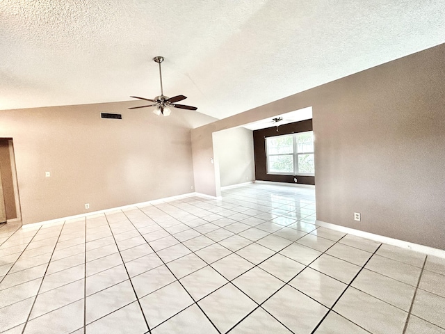 6404 Moonstone Way, Delray Beach, FL 33484 - unfurnished room featuring vaulted ceiling, ceiling fan, light tile patterned floors, and a textured ceiling