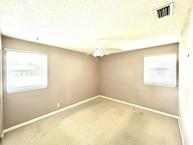 6404 Moonstone Way, Delray Beach, FL 33484 - unfurnished room featuring ceiling fan, carpet, and a textured ceiling