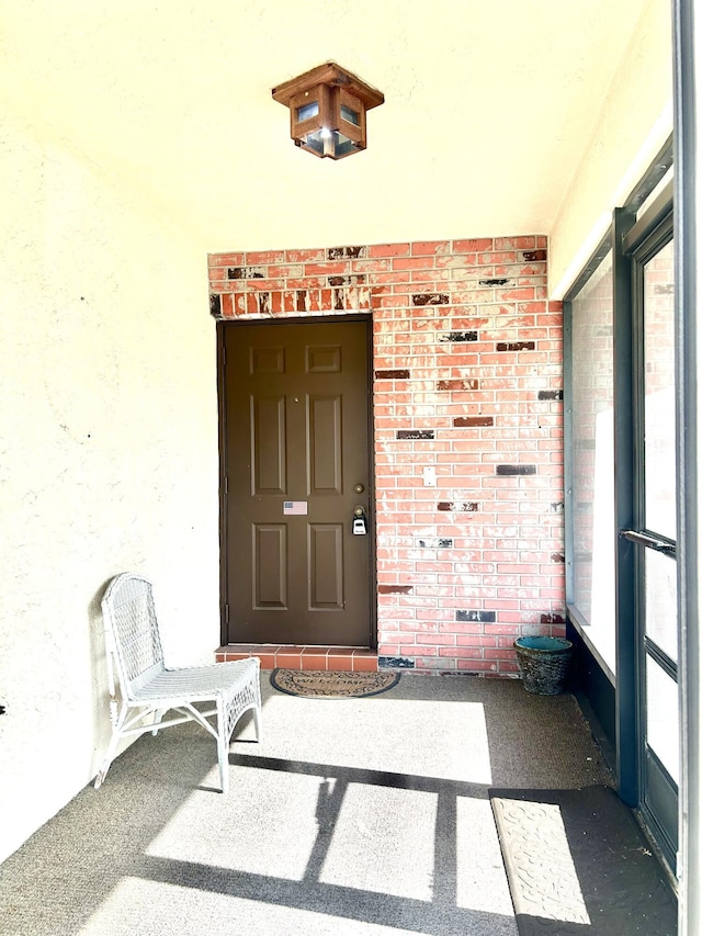 6404 Moonstone Way, Delray Beach, FL 33484 - view of exterior entry featuring stucco siding and brick siding