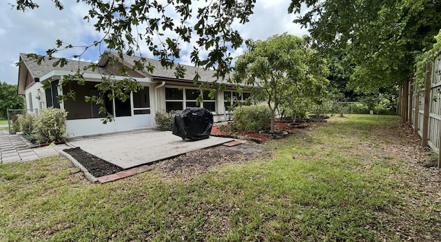 6404 Moonstone Way, Delray Beach, FL 33484 - back of property with a patio area, a sunroom, a fenced backyard, and a shingled roof