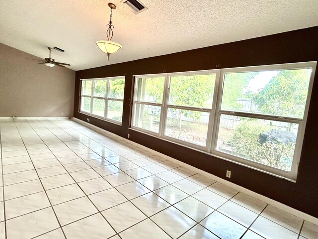 6404 Moonstone Way, Delray Beach, FL 33484 - spare room with lofted ceiling, a textured ceiling, ceiling fan, and light tile patterned floors