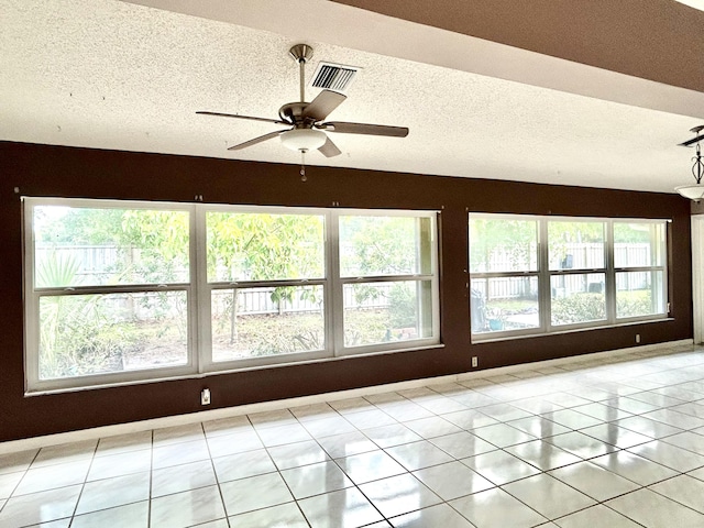 6404 Moonstone Way, Delray Beach, FL 33484 - spare room featuring a textured ceiling and a ceiling fan