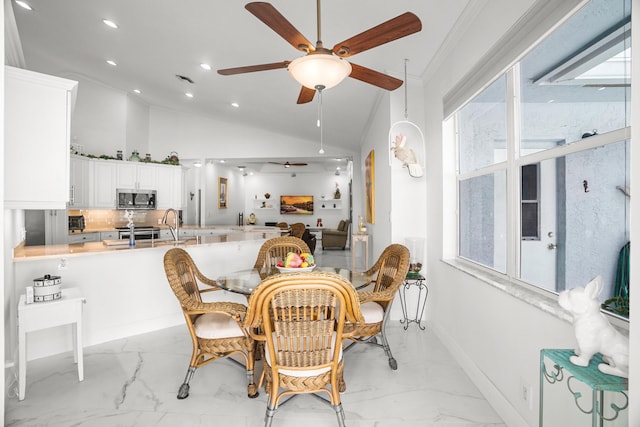 1680 SW 16th St, Boca Raton, FL 33486 - dining room with light marble finish flooring, a ceiling fan, recessed lighting, lofted ceiling, and ornamental molding