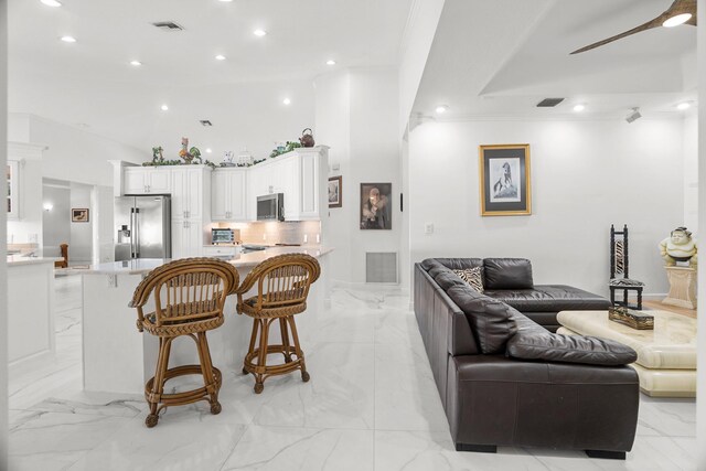 1680 SW 16th St, Boca Raton, FL 33486 - living area with light marble finish floors, recessed lighting, and ceiling fan