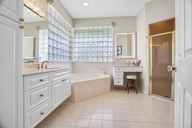 1680 SW 16th St, Boca Raton, FL 33486 - bathroom featuring vanity, a garden tub, a stall shower, and tile patterned flooring