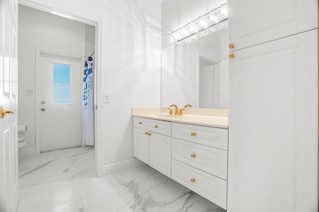 1680 SW 16th St, Boca Raton, FL 33486 - bathroom with marble look tiles and vanity