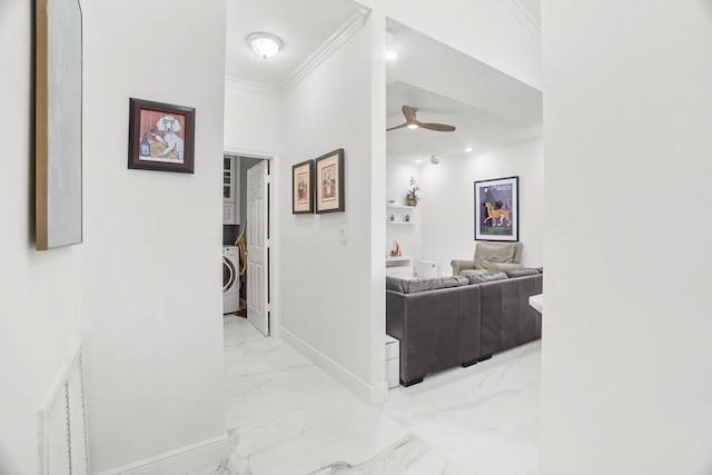 1680 SW 16th St, Boca Raton, FL 33486 - corridor with light marble finish floors, washer / dryer, and crown molding