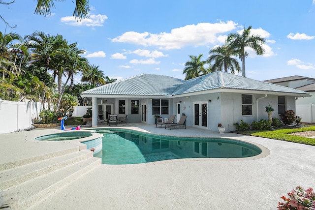 1680 SW 16th St, Boca Raton, FL 33486 - view of pool with french doors, a fenced backyard, a patio area, and a pool with connected hot tub