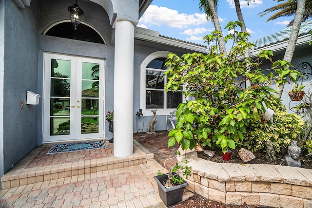 1680 SW 16th St, Boca Raton, FL 33486 - doorway to property featuring french doors and stucco siding