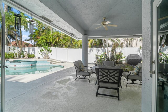 1680 SW 16th St, Boca Raton, FL 33486 - fenced backyard with a patio area, a ceiling fan, area for grilling, and a pool with connected hot tub