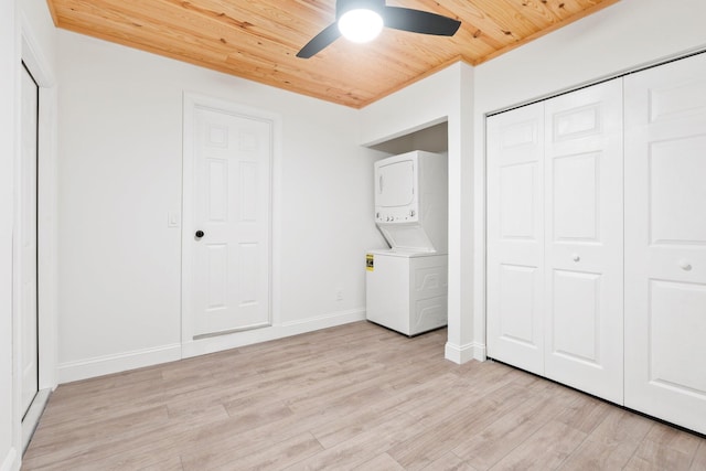 677 NE Alice St, Jensen Beach, FL 34957 - unfurnished bedroom with stacked washer / drying machine, wooden ceiling, light wood finished floors, baseboards, and ceiling fan