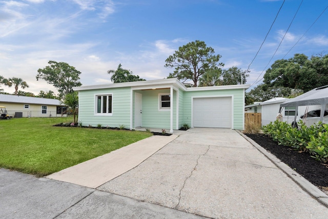 677 NE Alice St, Jensen Beach, FL 34957 - mid-century modern home with a garage and concrete driveway