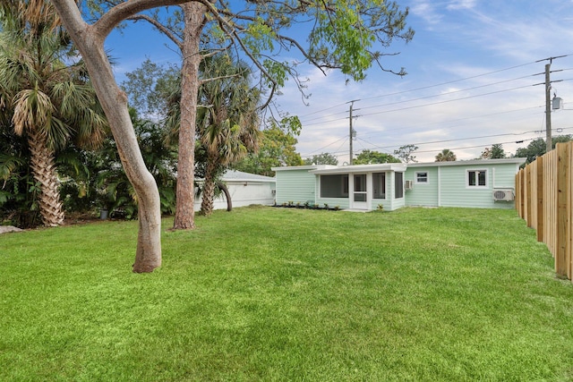 677 NE Alice St, Jensen Beach, FL 34957 - view of yard featuring a sunroom