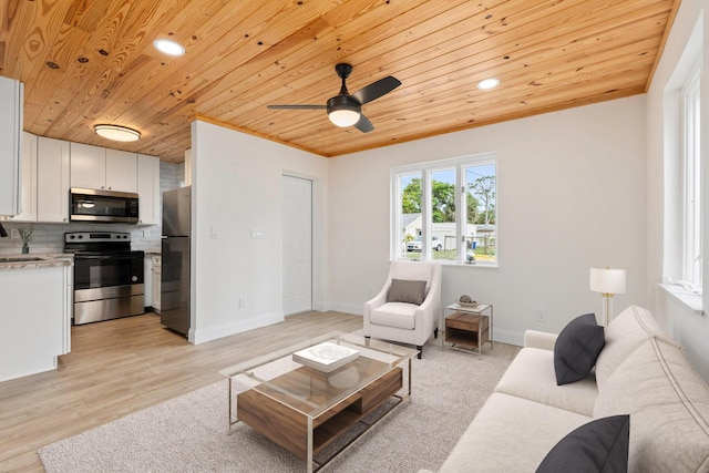 677 NE Alice St, Jensen Beach, FL 34957 - living area with wood ceiling, a ceiling fan, recessed lighting, baseboards, and light wood-style floors