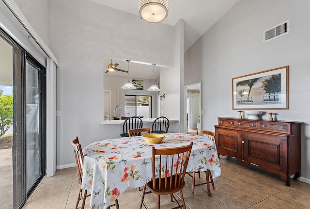 202 Lakewood Dr Unit 11C, Jupiter, FL 33458 - dining room with high vaulted ceiling and tile patterned floors