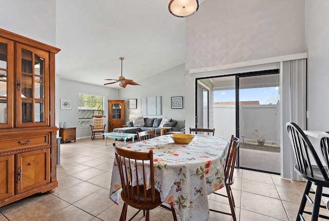202 Lakewood Dr Unit 11C, Jupiter, FL 33458 - dining space with light tile patterned flooring, ceiling fan, and high vaulted ceiling