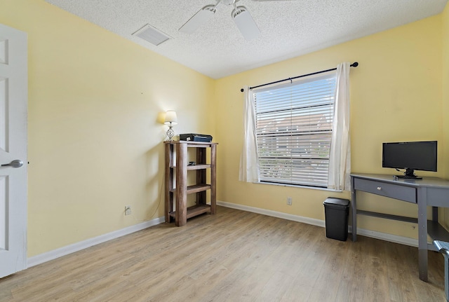 202 Lakewood Dr Unit 11C, Jupiter, FL 33458 - office space featuring wood finished floors, a textured ceiling, baseboards, and a ceiling fan