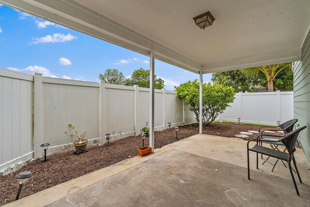 202 Lakewood Dr Unit 11C, Jupiter, FL 33458 - fenced backyard featuring a patio area