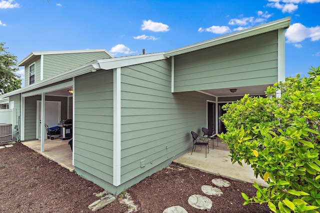 202 Lakewood Dr Unit 11C, Jupiter, FL 33458 - view of side of home with a patio