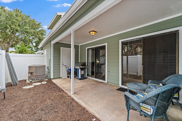 202 Lakewood Dr Unit 11C, Jupiter, FL 33458 - view of patio / terrace with cooling unit and area for grilling