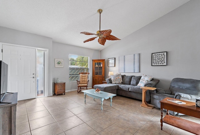 202 Lakewood Dr Unit 11C, Jupiter, FL 33458 - living room with ceiling fan, light tile patterned floors, lofted ceiling, and a textured ceiling