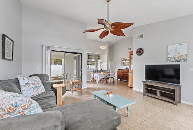 202 Lakewood Dr Unit 11C, Jupiter, FL 33458 - living area featuring light tile patterned floors, a ceiling fan, high vaulted ceiling, and baseboards