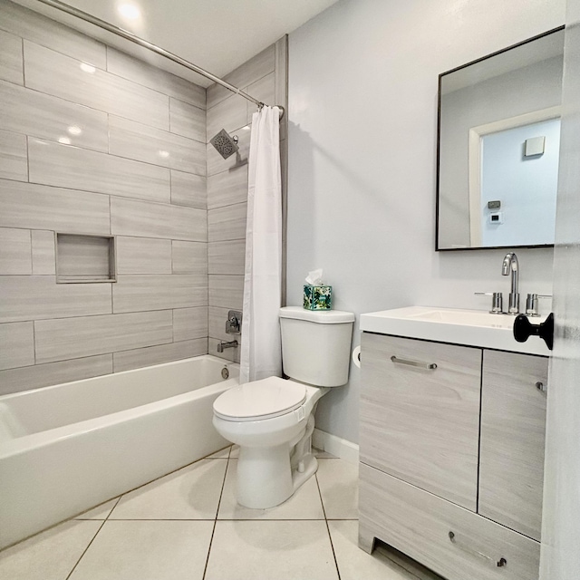 727 Sunny Pine Way Unit H, Greenacres, FL 33415 - bathroom featuring toilet, vanity, tile patterned floors, shower / bath combo with shower curtain, and baseboards