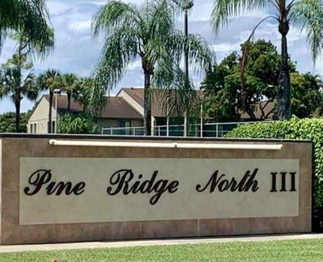 727 Sunny Pine Way Unit H, Greenacres, FL 33415 - community sign with a lawn