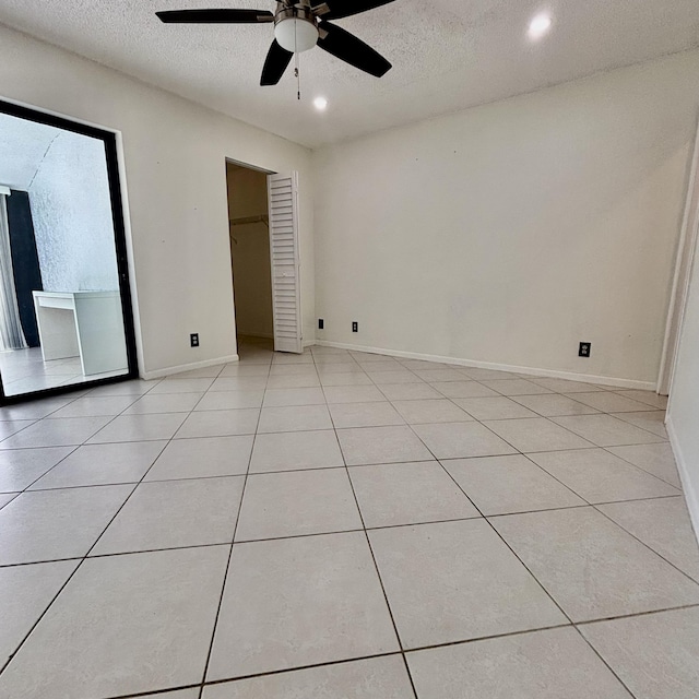 727 Sunny Pine Way Unit H, Greenacres, FL 33415 - unfurnished bedroom featuring a textured ceiling, light tile patterned flooring, recessed lighting, a ceiling fan, and baseboards