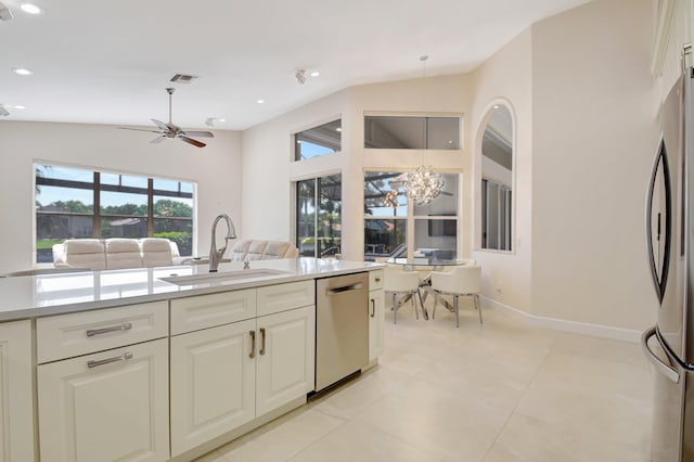 13209 Alhambra Lake Cir, Delray Beach, FL 33446 - kitchen with a sink, appliances with stainless steel finishes, a chandelier, vaulted ceiling, and light countertops