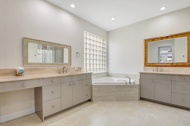 13209 Alhambra Lake Cir, Delray Beach, FL 33446 - bathroom with two vanities, a bath, tile patterned floors, a shower, and recessed lighting