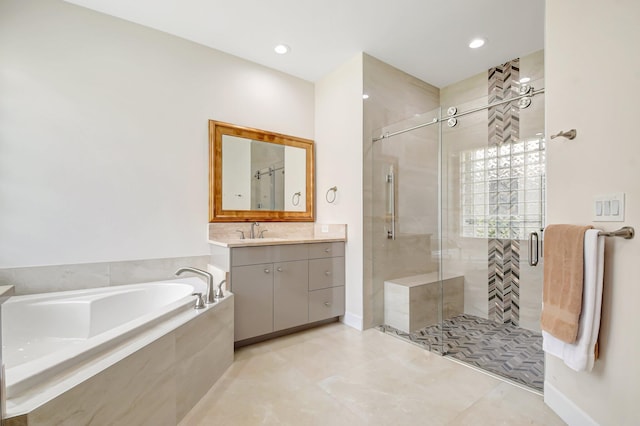 13209 Alhambra Lake Cir, Delray Beach, FL 33446 - full bath with a bath, vanity, a stall shower, tile patterned floors, and recessed lighting