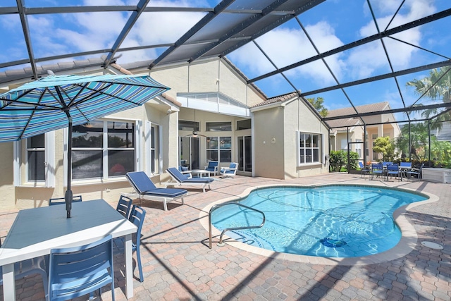 13209 Alhambra Lake Cir, Delray Beach, FL 33446 - outdoor pool with a patio, a lanai, and outdoor dining space