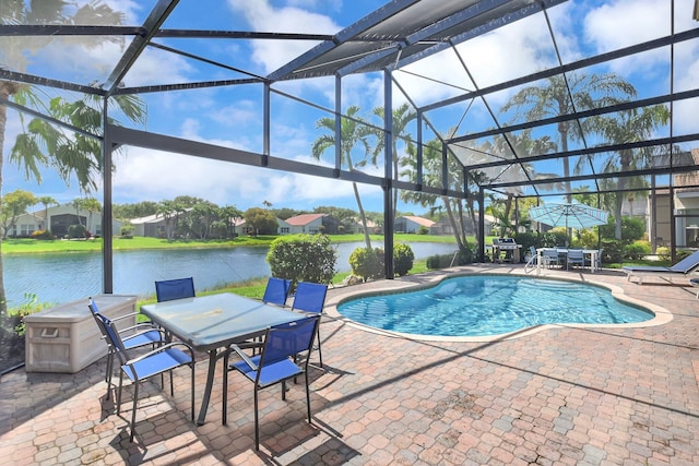 13209 Alhambra Lake Cir, Delray Beach, FL 33446 - outdoor pool with outdoor dining space, a patio, a water view, area for grilling, and a lanai