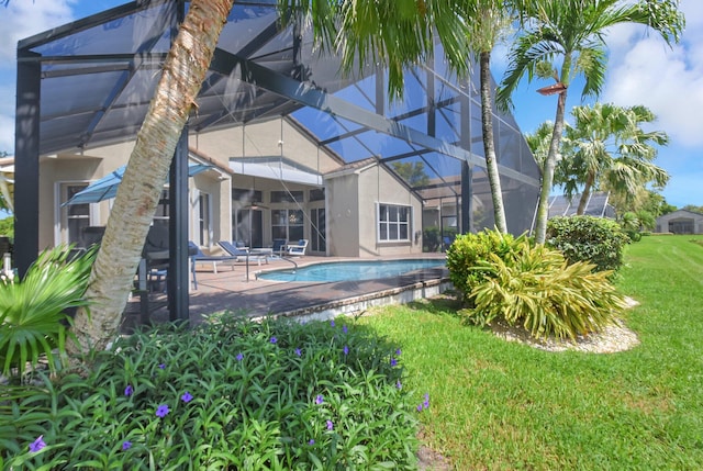 13209 Alhambra Lake Cir, Delray Beach, FL 33446 - outdoor pool with a lanai, a yard, and a patio area