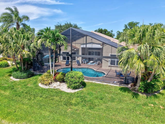 13209 Alhambra Lake Cir, Delray Beach, FL 33446 - swimming pool with a patio, a lawn, and a lanai