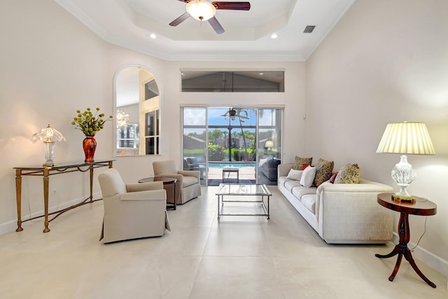 13209 Alhambra Lake Cir, Delray Beach, FL 33446 - living area featuring ceiling fan, a tray ceiling, baseboards, crown molding, and recessed lighting
