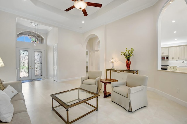 13209 Alhambra Lake Cir, Delray Beach, FL 33446 - living area with arched walkways, ceiling fan, recessed lighting, a high ceiling, and french doors