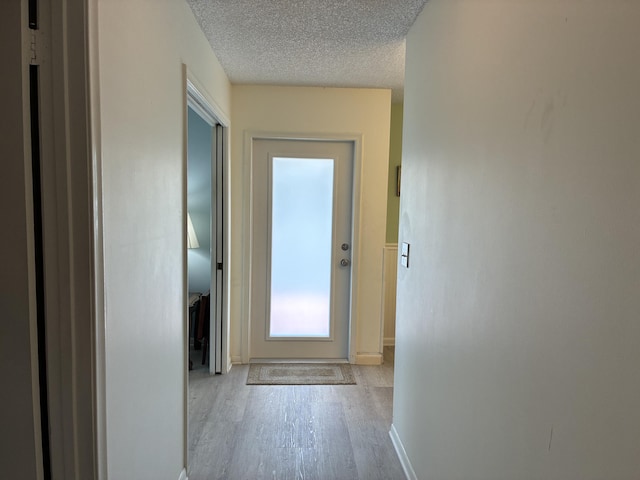 5178 Privet Pl Unit D, Delray Beach, FL 33484 - hallway with wood finished floors, baseboards, and a textured ceiling